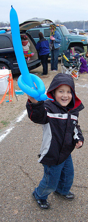 child with a balloon sword